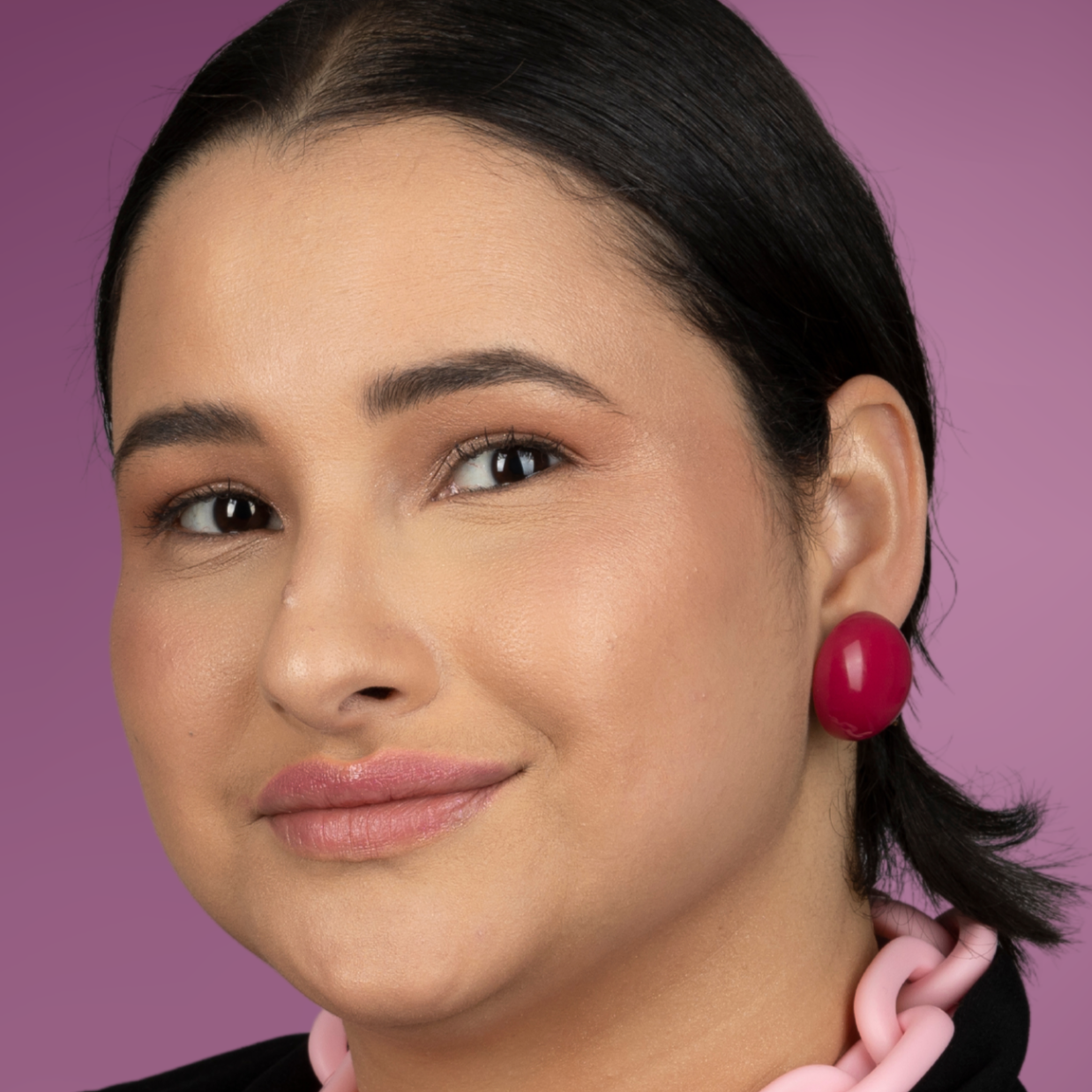 model-wearing-ana-harris-store-maxi-button-earrings-pink