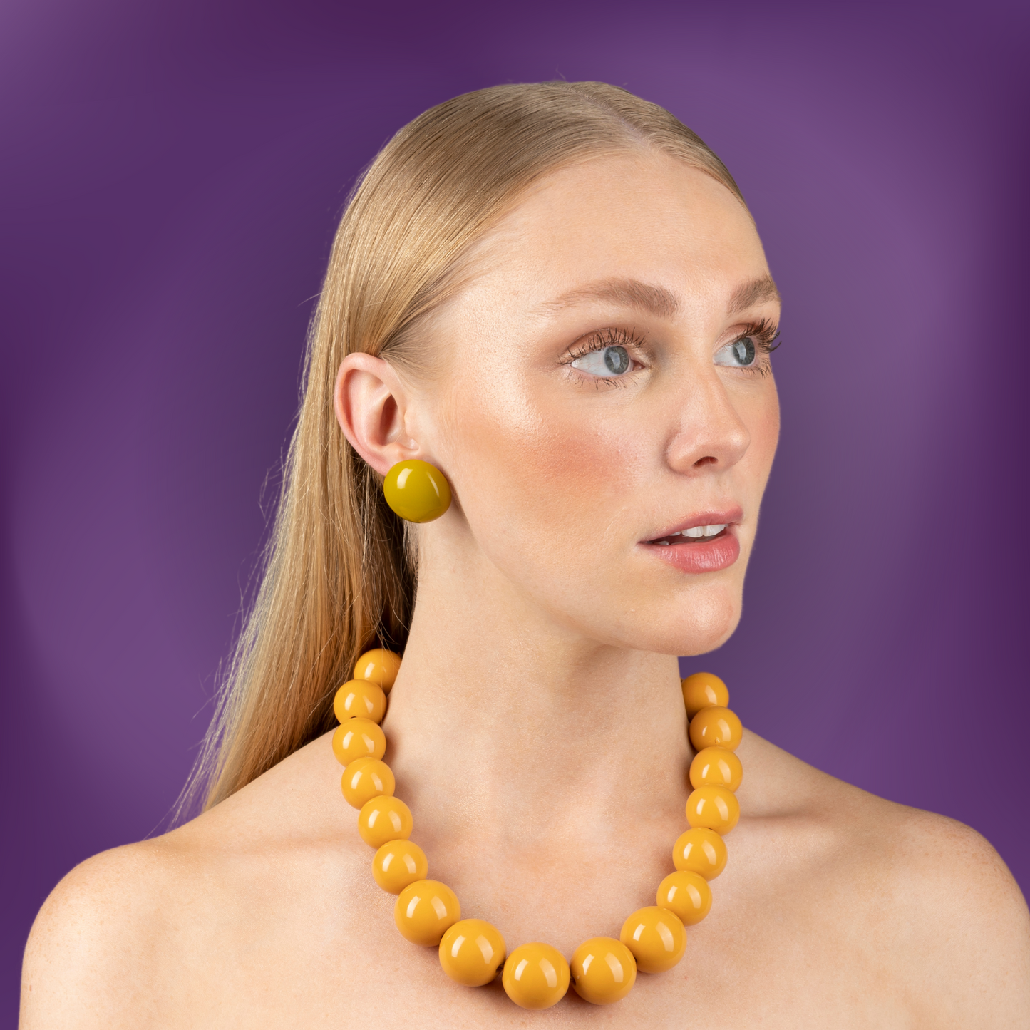 model-wearing-ana-harris-store-maxi-button-earrings-mustard