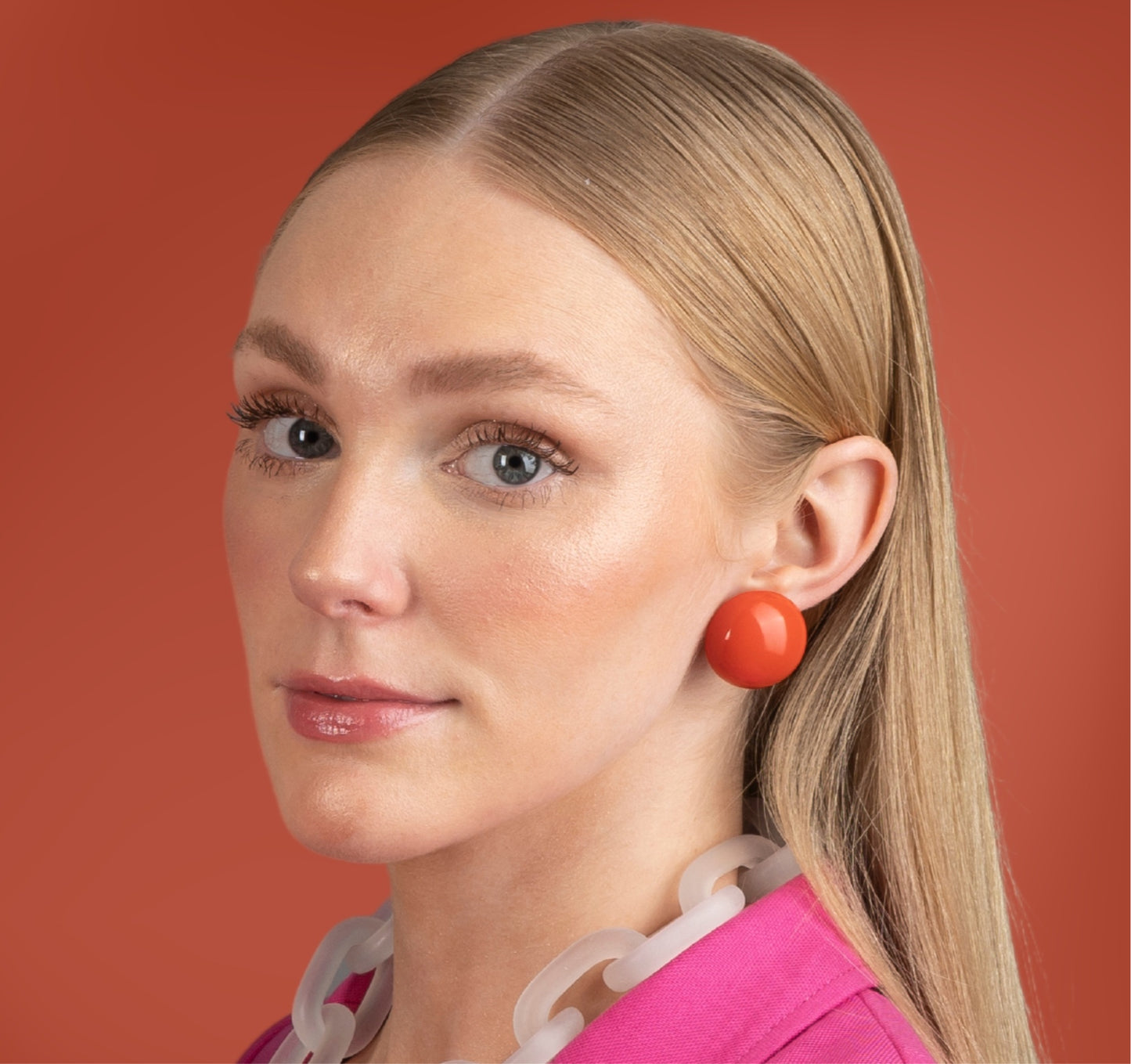 Model-earring-ana-harris-store-Button-Earrings-orange